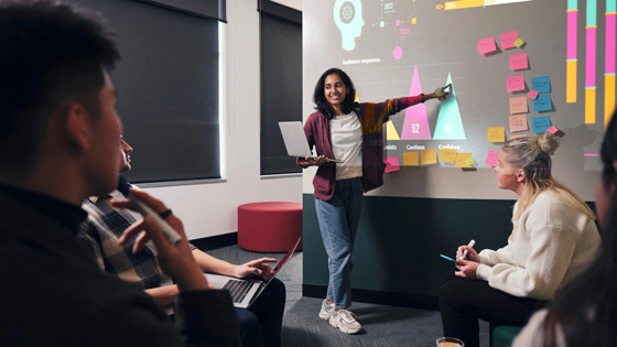Students engaging in a Marketin meeting
