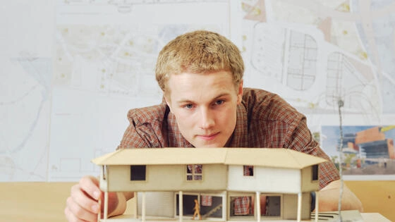 Deakin bachelor of design architecture student works on model building on campus.