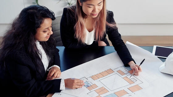 Two Deakin bachelor of design (architecture) / construction students work together on campus.