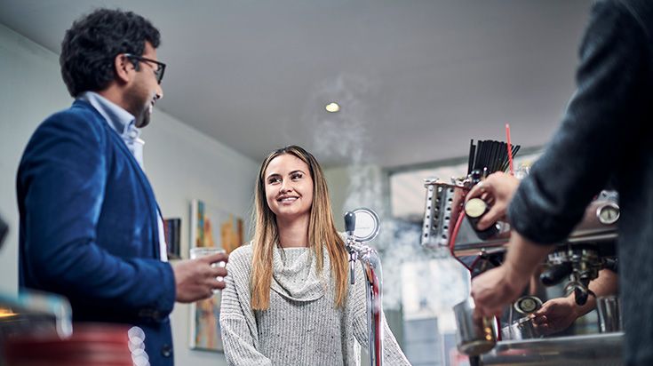 Students smile while waiting for coffee at a cafe - CBD