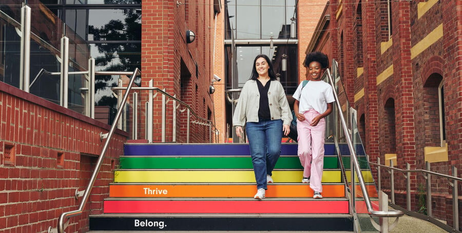 Students walking down lgbtiq+ stairs at the Waterfront campus.