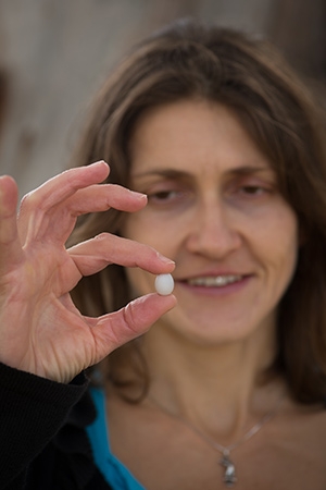 Dr Mylene Mariette with a zebra finch egg.