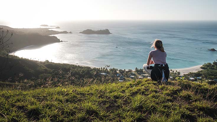 Woman looking at the ocean in Fiji