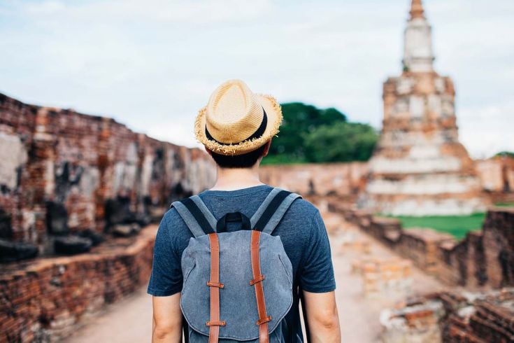 Student in Asia walking with back to camera