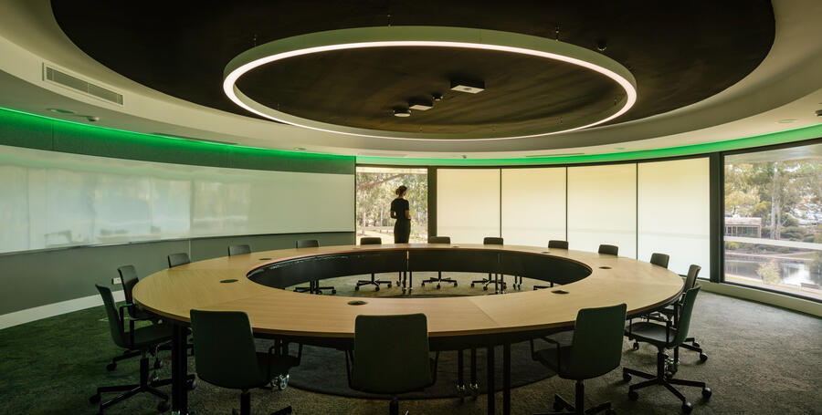 Student standing in the circular think tank room at the Nyaal precinct