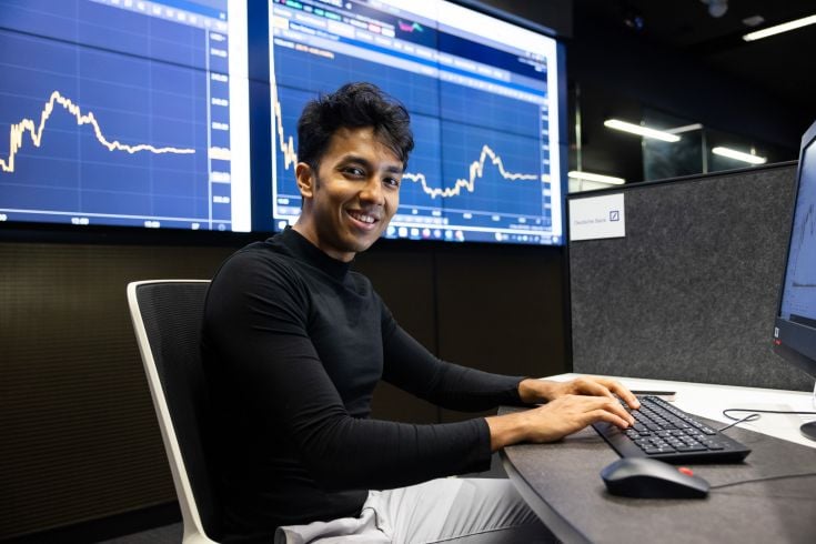 Man typing and smiling