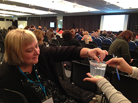 Teachers from Spring Gully Kinder in Bendigo take a floating straw and make it sink