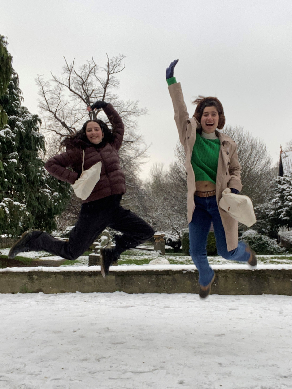 Students jumping in the snow at Roehampton