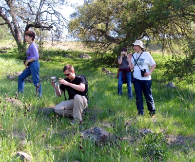 Professor Marlene Zuk (far left) in the field.