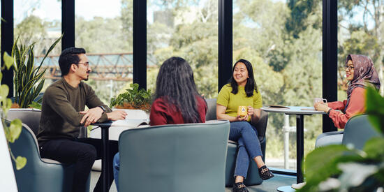 Group of students sitting in Melbourne Burwood Campus residence.