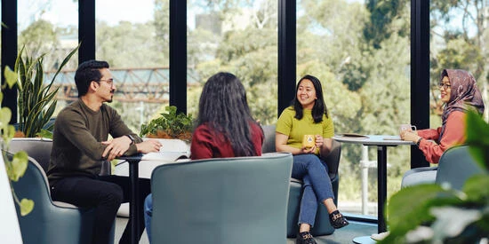 40396-550x275-deakin-students-residence Group of students sitting in Melbourne Burwood Campus residence.