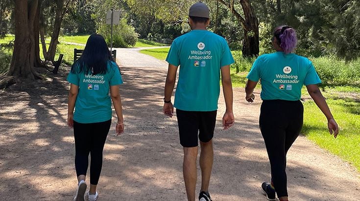 Three Wellbeing Ambassadors walking outside at Burwood Campus