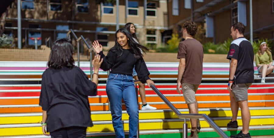 Students on the Pride Stairs at Geelong Waurn Ponds Campus. 