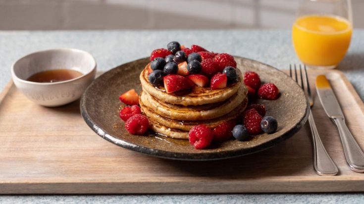 A stack of pancakes with berries