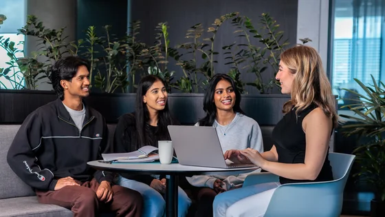 Law students work at a café table.