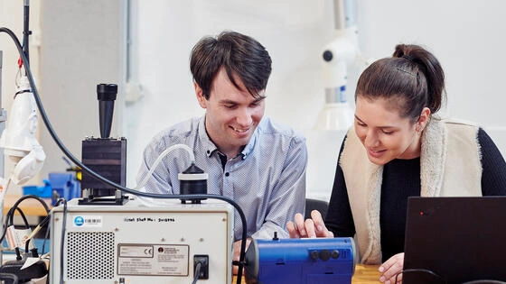 Two Deakin bachelor of engineering industry honours students work in campus lab together.