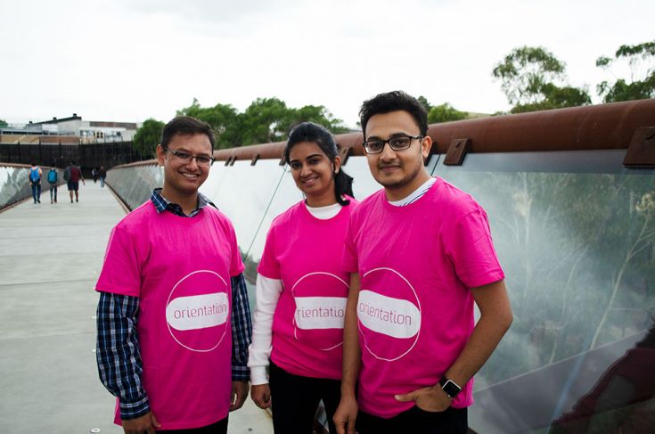 Three student experience ambassadors s in orientation tshirts