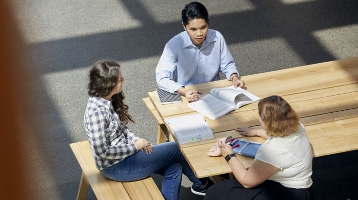 Three students studying together