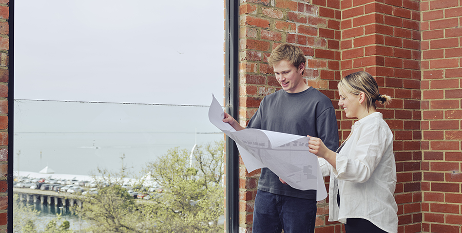 Two students going over designs inside