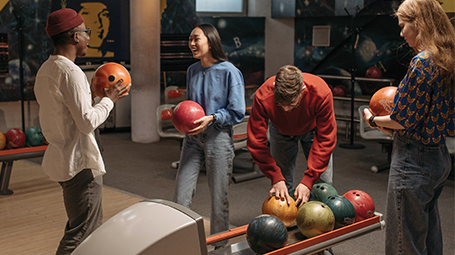 International students having fun while bowling