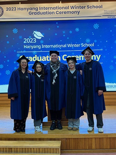 Belinda and fellow graduates at a ceremony