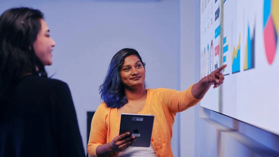 Deakin bachelor of data science student standing in classroom on campus.