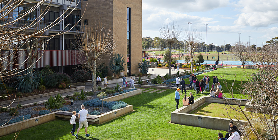 Deakin students on the lawn at Geelong Waurn Ponds Campus.