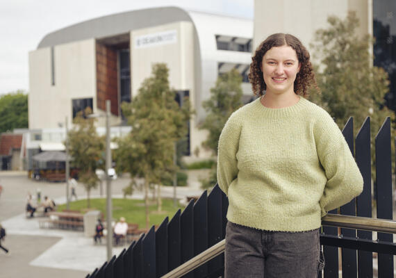 Chantelle is standing on a balcony on Deakin's Burwood campus