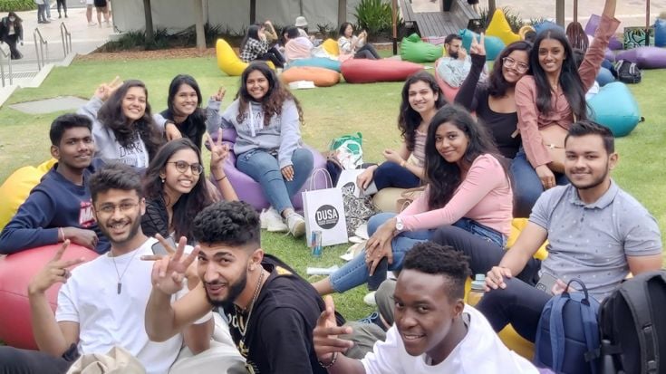 Group of happy students on campus