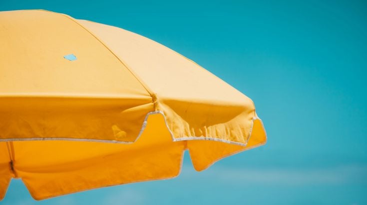 A bright yellow beach umbrella