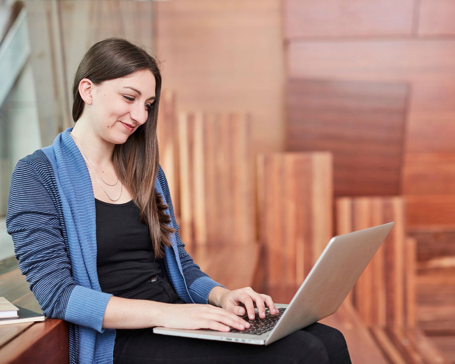 A student working on her laptop