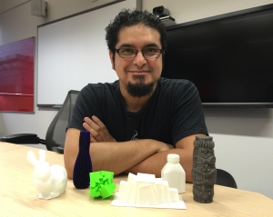Dr George Aranda, with some objects made pozible by 3D printing.