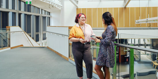 Deakin staff member speaking with student