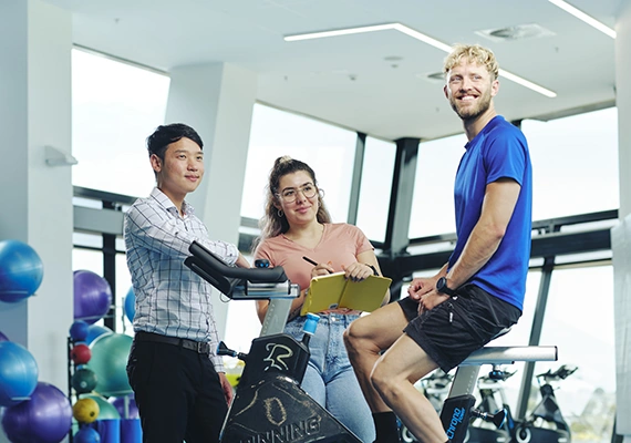 Students working with exercise bike