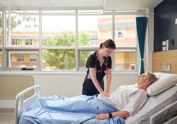 A Deakin nursing student with patient.