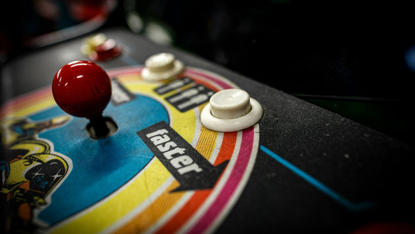 Image of a pinball machine joystick and buttons