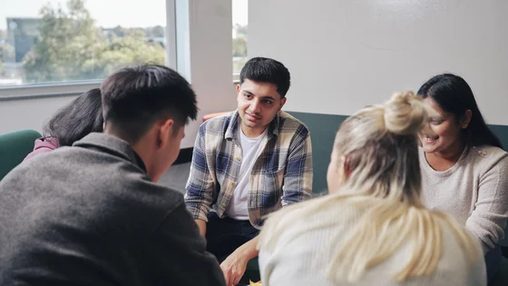 A group of Deakin marketing students in discussion.