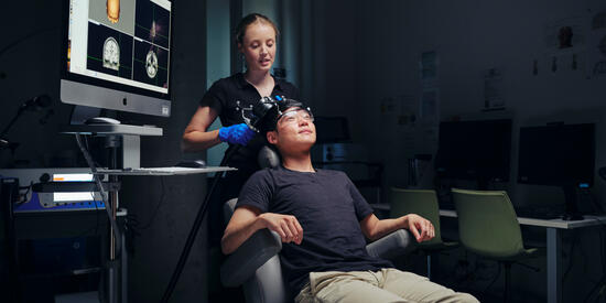 A Deakin neuroscience student uses brain scan equipment 