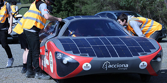Acciona solarcar drives along a road 