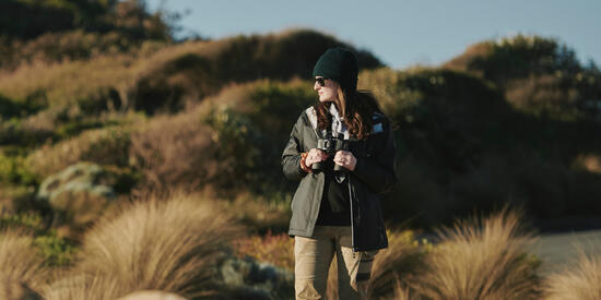 Wildlife and Conservation Biology students in a rocky landscape.