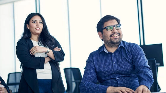 Two Deakin graduate diploma of property students in a building together.