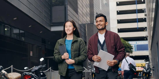 Two students walking to class through the melbourne CBD