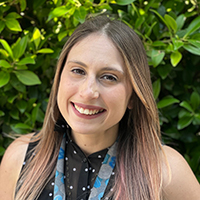 A headshot of Lauren Abel smiling at the camera.