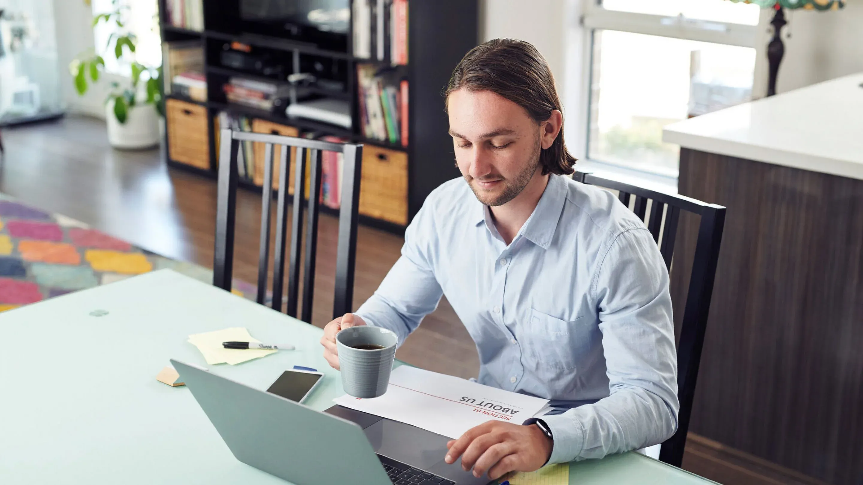 Man at table on laptop