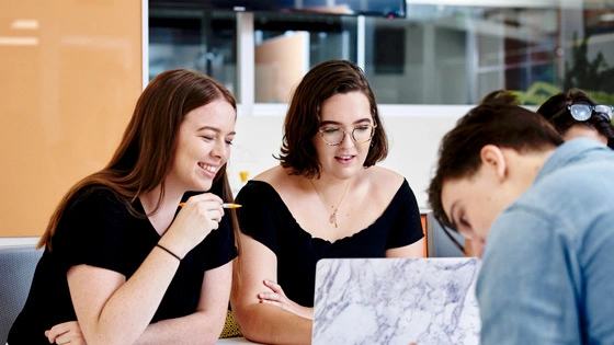 Four students having a discussion on a table