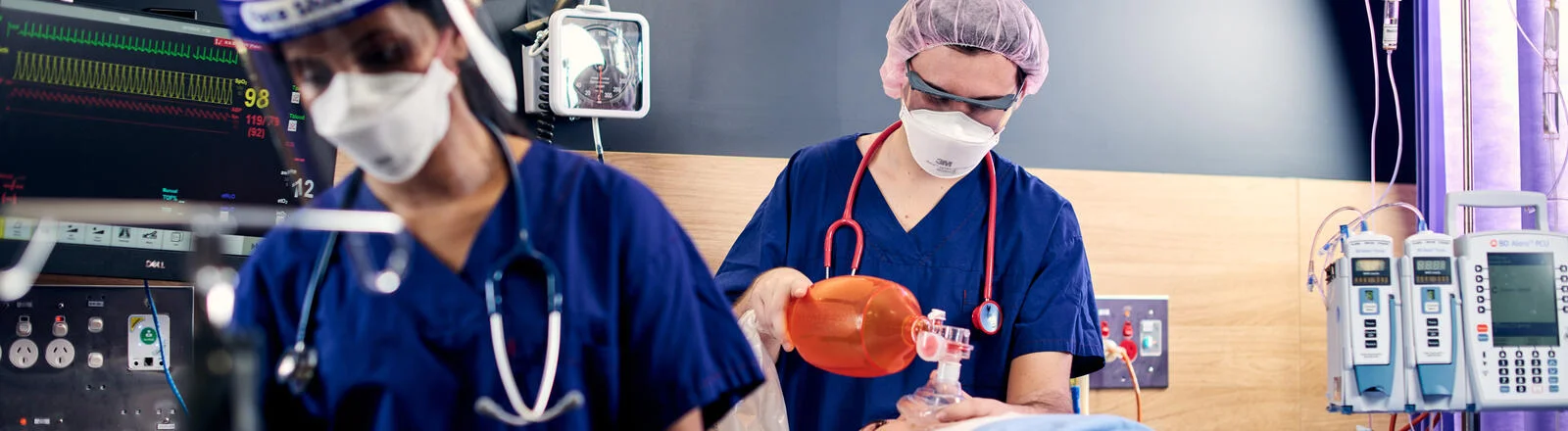 Deakin graduate diploma of intraoperative nursing students in clinical hospital setting with a patient.