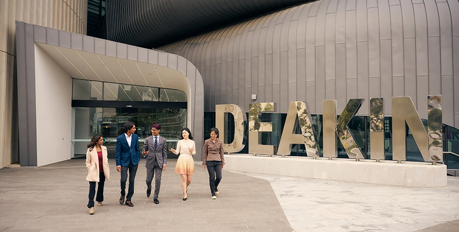 Deakin students walk outside the law building at Melbourne Burwood Campus.