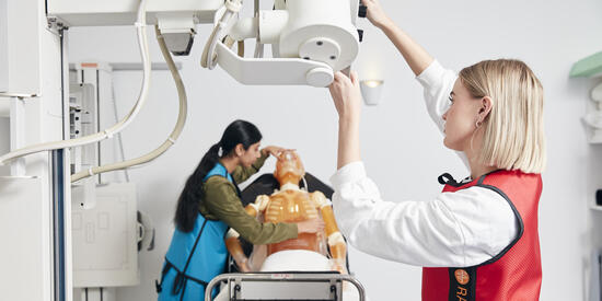 A Deakin medical imaging student using equipment in the Deakin lab