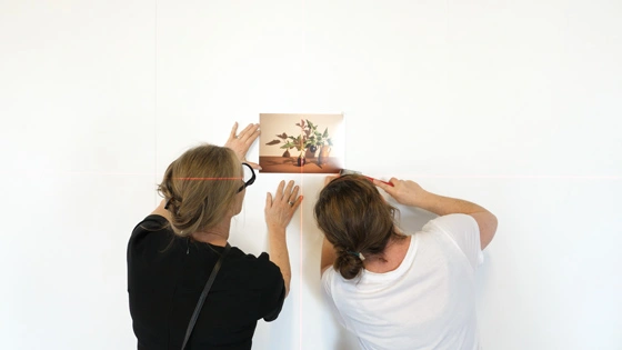 Creative Arts student hangs artwork in gallery
