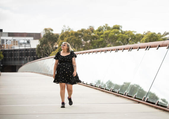 Deakin student walks across Burwood Campus bridge